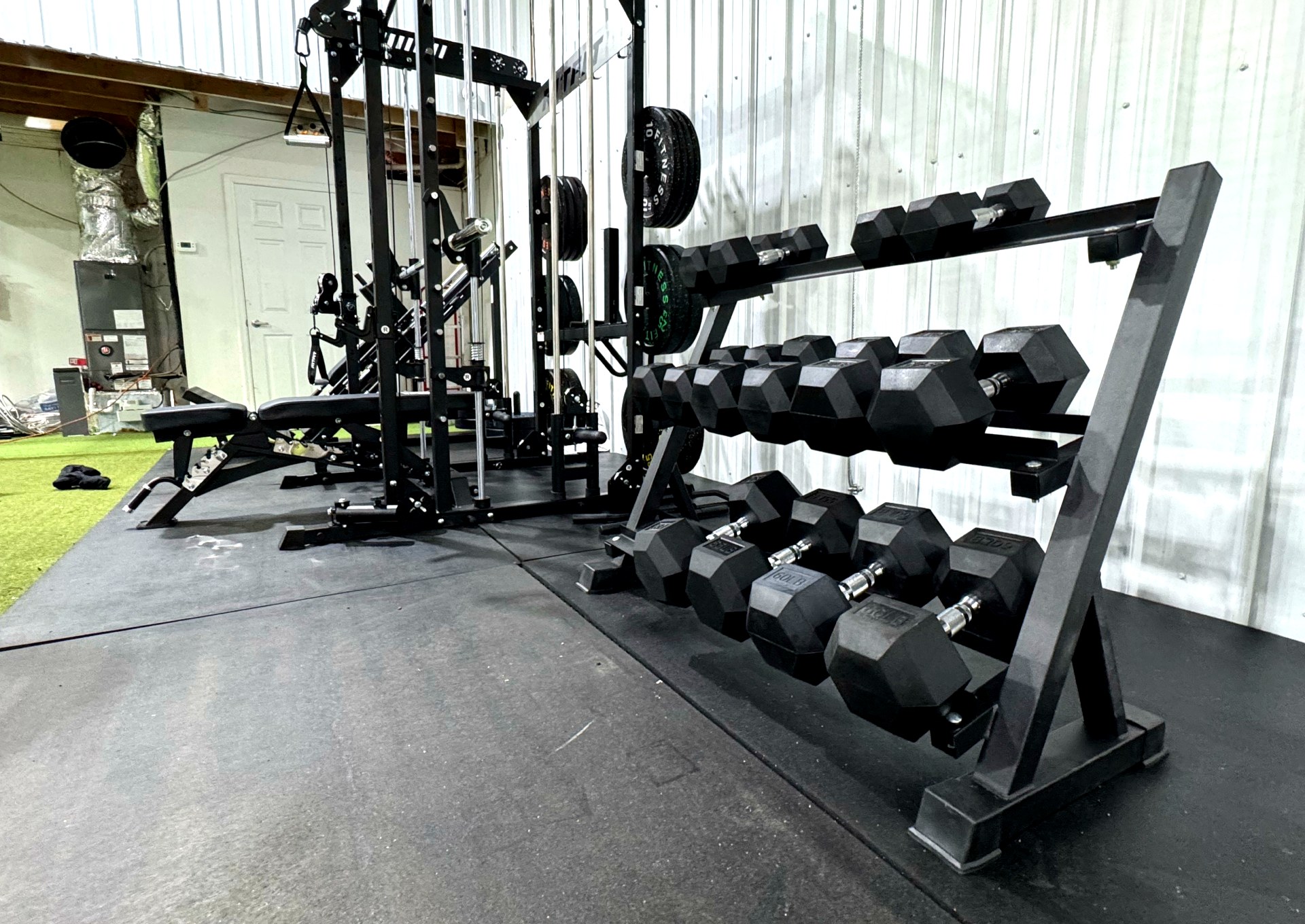 Dumbbell rack and cable machine at Strike Zone Chattanooga