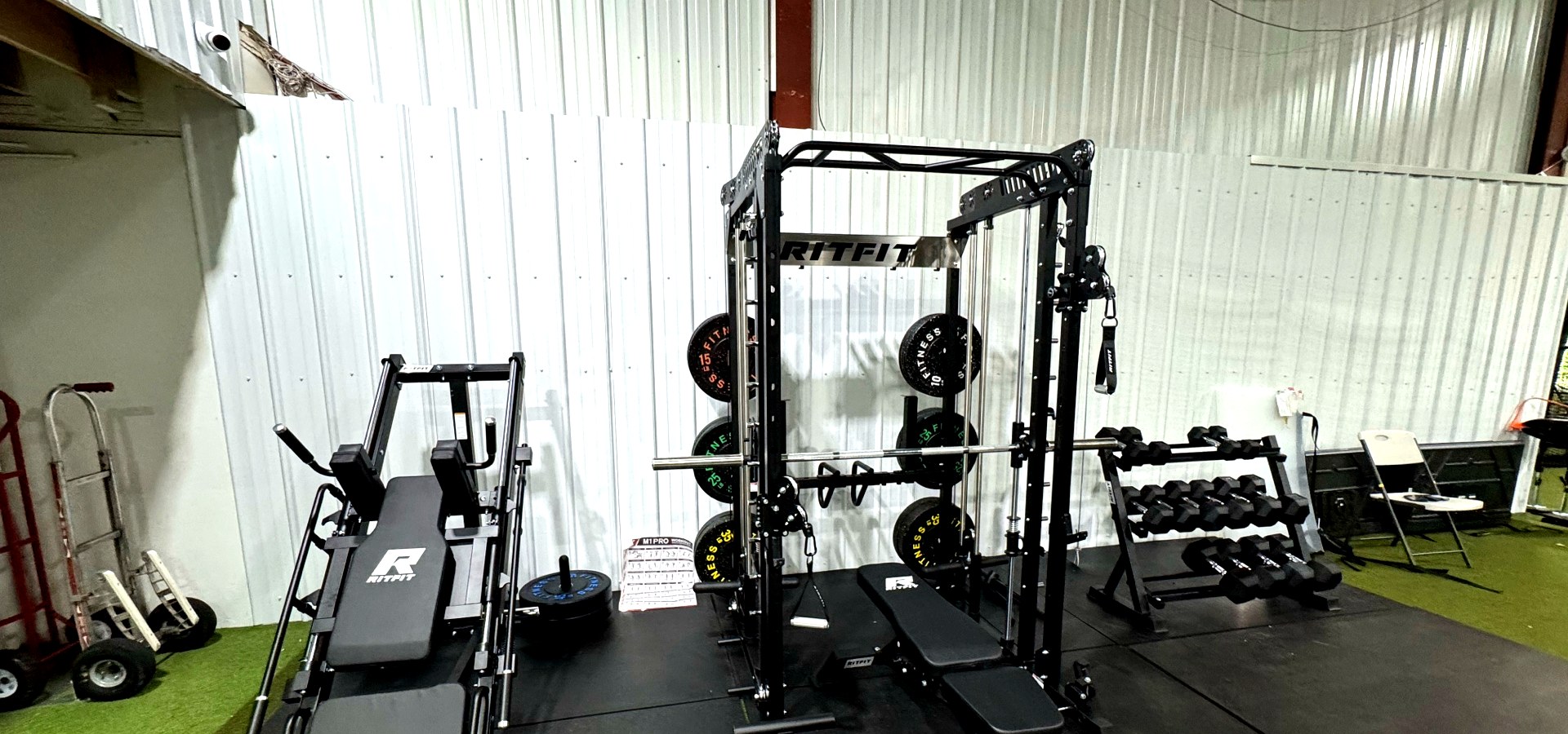 Strike Zone Chattanooga strength and conditioning area with cable rack and dumbbells